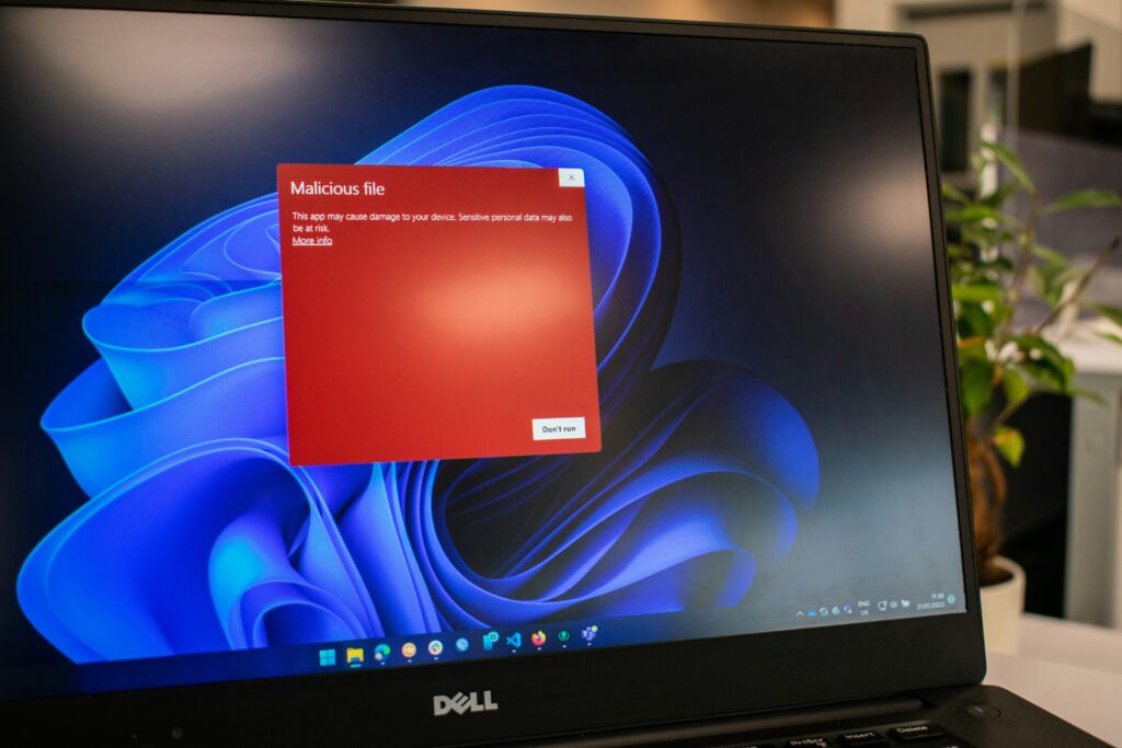 A modern laptop displaying a website's admin panel, showing updates and security notifications.